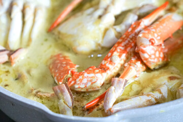 Close up of crab cooked in spicy coconut milk or Ketam Masak Lemak Cili Api.