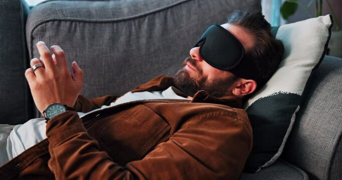 Man, talking or eye mask for psychology, hypnotherapy or hypnosis on sofa at private practice. Male person, relax or speaking in therapy or rest for trauma, PTSD counseling or psychotherapy at office