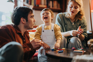 A cheerful family spends quality time crafting together at home, fostering creativity and bonding through shared activities and laughter.