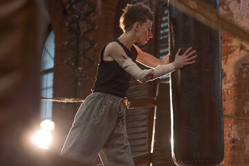 A moment of relaxation before new achievements,concept, sporting achievements, female wrestler in the boxing ring, cinematic look, mood, motivational stories