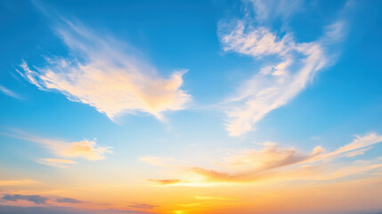 beautiful celestial sky with wispy clouds illuminated by golden hues.