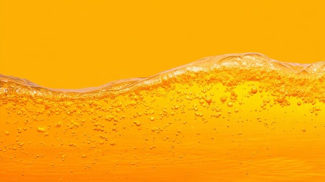 Close-up of vibrant orange liquid wave with smooth curves and floating bubbles, abstract texture of oil or beer splash for dynamic fluid design backgrounds