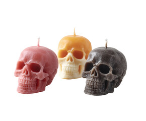 Three skull candles in various colors, perfect for spooky halloween celebrations.