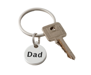 A silver keyring with a key and a charm that says 'Dad', perfect for a gift.