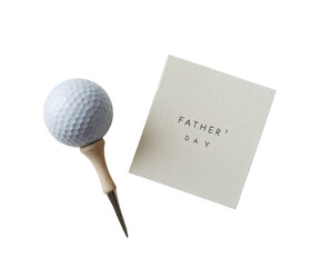 A golf ball on a tee with a Father's Day card, perfect for a thoughtful gift.