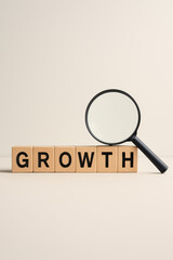 This symbolizes business development and progress by highlighting key aspects growth with a magnifying glass emphasizing analysis