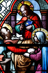 Saint-Pierre church.  Stained glass. The death of Saint Joseph surrounded by the Blessed Virgin and Jesus. Chateau Chalon. France.