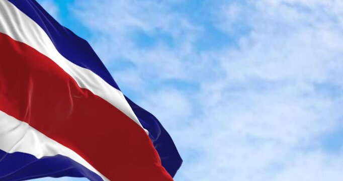 Costa Rica national civil flag waving in the wind on a clear day