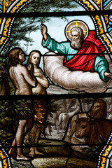 Fototapeta premium Adam and Eve, expulsion from Paradise. Saint Germain church. Stained glass. Saint-Germain du Bois. France.