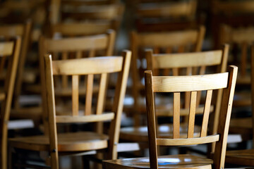 Saint Germain church. Empty wooden chairs. Saint-Germain du Bois. France.