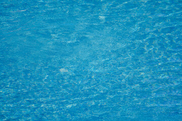 texture with shiny surface of a swimming pool on a sunny summer day