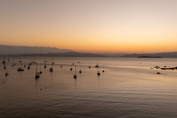 Golden light over the ocean, charming restaurants by the sea, and a peaceful beach village atmosphere on Brazil’s southern coast.