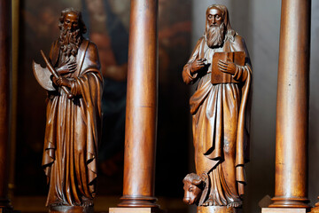 Collegiate Church of Saint-Jacques le Majeur.  Wooden sculpture of a religious saint. Wooden...