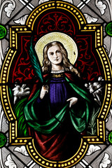 Fototapeta premium Saint Marien church. Stained glass. Saint John the Evangelist.. Mezilles. France.