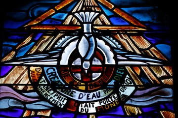 Saint-Etienne du Pont Neuf church. Stained glass. The dove of peace, which represents the Holy Spirit.  Annecy. France.