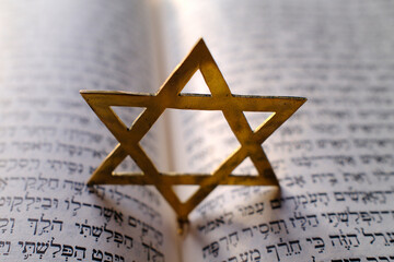 Judaism. The Bible in Hebrew with a star of David.