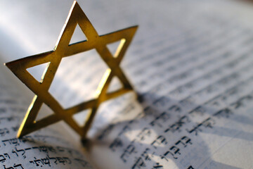 Fototapeta premium Judaism. The Bible in Hebrew with a star of David.