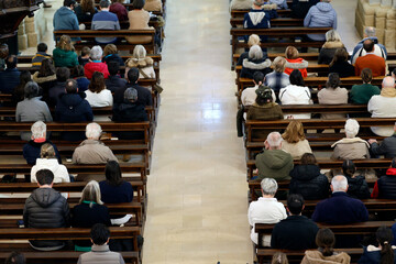 Mass in a roman catholic church. Church full of parishioners. Saint Jean Baptiste church.  ...