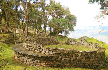 Ancient stone round house ruins with the iconic geometric pattern on the outside wall, Kuelap...