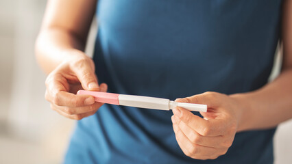 Woman waiting for pregnancy test result
