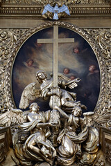 Angels, the cross, and the Holy Spirit. Symbols of Christianity. Warsaw. Poland.