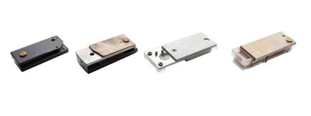 A group of four different types of metal parts