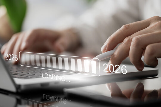 2025–2026 Progress Hologram Above Laptop