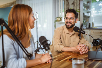 man and woman host and guest in podcast at home studio