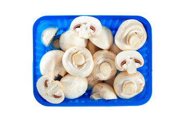 Whole and sliced ​​champignons in a container isolated on white background.