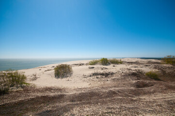 Beautiful scene of a sandy  dunes and sea