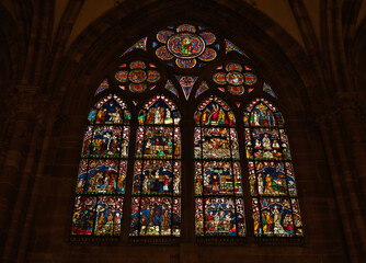 Photograph shows a view of a stained glass window in Notre-Dame Cathedral in Strasbourg, France.