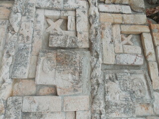 detail of the facade of the uxmal mayan ruins