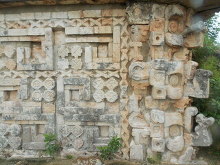 detail of the facade of the uxmal mayan ruins