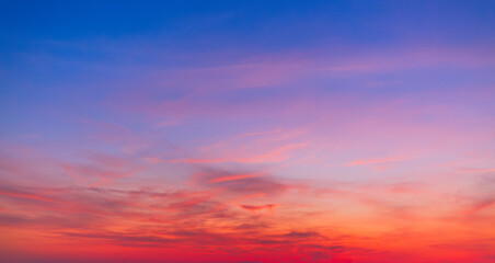 Colorful sky backdrop in the morning,Nature beautiful Light Sunset or sunrise sky,Sunset Sky Background in the Evening with Dramatic Dusk Clouds and Colorful Pink, Orange Sunlight on Blue Twilight sky