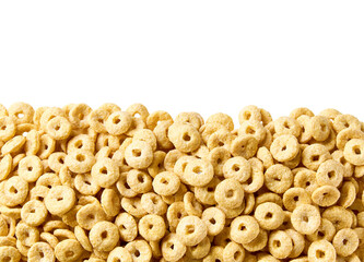 Whole grain cereal rings in a white background, close up, top view. Crispy cereal loops in a white background.