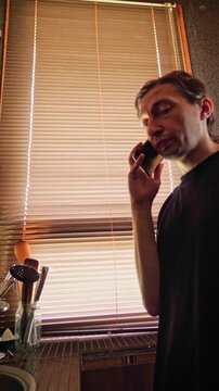 A conversational and attentive mood is captured, perfect for depicting everyday communication, a serious discussion, or a moment of connection, with soft light from window blinds adding ambience