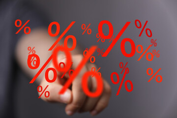 Image of a hand interacting with percentage symbols, ideal for discount, sale, or finance concepts.