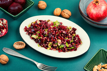 Healthy vegan beetroot salad with walnuts.