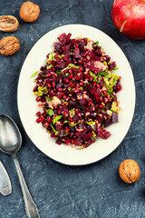Healthy salad - boiled beetroot with pomegranate.