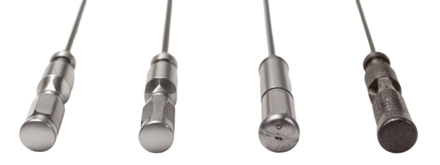 A set of four different types of metal tools