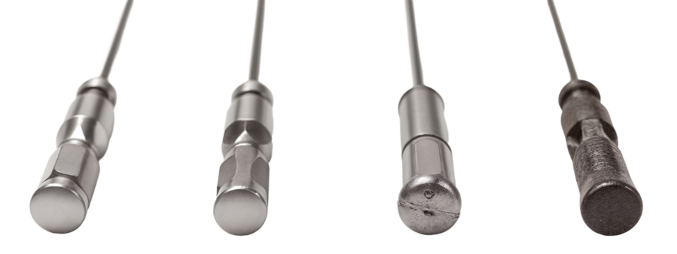 A set of four different types of metal tools