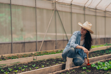 women young people  learning about farming, farming, and cultivation in a greenhouse.