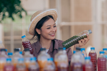 women young people  learning about farming, farming, and cultivation in a greenhouse.The water...