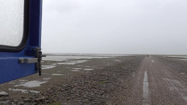 Mando, Denmark The view from a bus traversing the tidal plains to Mando Island over North Sea marshes. 