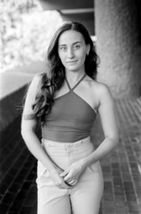 Young woman posing in vintage monochrome 35mm film style portrait