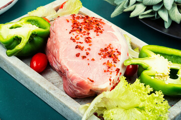 Raw cut of pork meat.