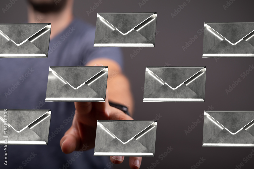 Leinwandbilder a hand selects a digital email from a group of floating messages.