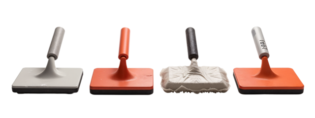 A set of four different colored trowels