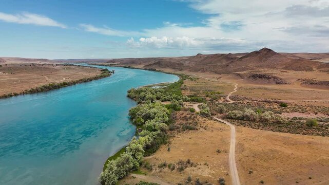 Drone shot of river Ili and spring steppe in Kazakhstan