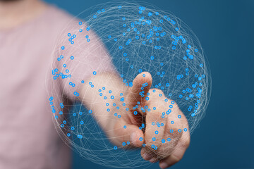 Abstract image of a hand interacting with a digital global network.  Perfect for technology, connection, and globalization concepts.